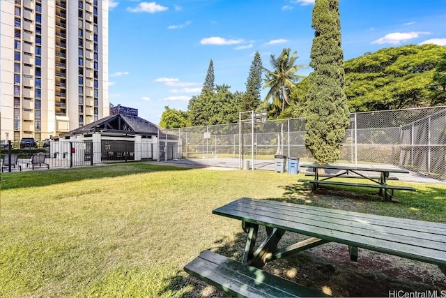 surrounding community featuring a yard, fence, and a gazebo