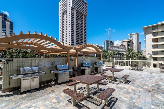 view of patio / terrace featuring a pergola and area for grilling