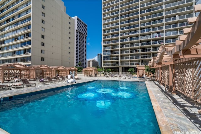 view of swimming pool featuring a patio area