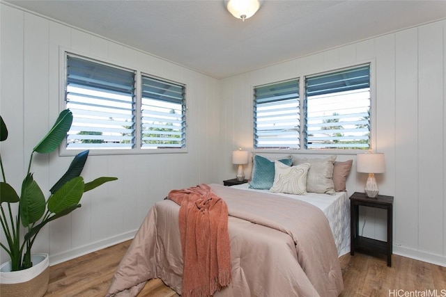 bedroom with hardwood / wood-style floors