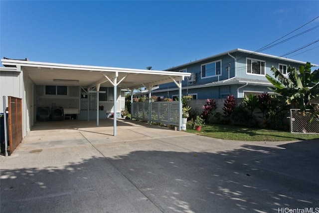 view of front of property featuring a carport