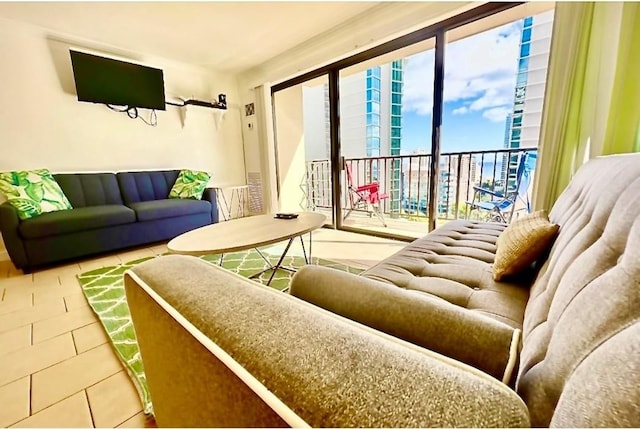 tiled living room featuring a healthy amount of sunlight