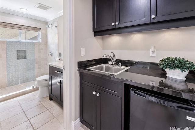 kitchen featuring sink, stainless steel dishwasher, and ornamental molding