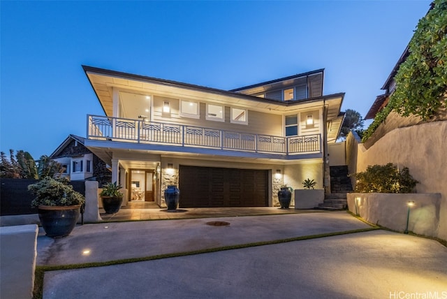 modern home with a garage and a balcony