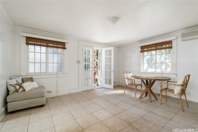 dining area with light tile patterned floors, a wall unit AC, a wealth of natural light, and crown molding