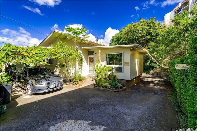 view of front of property featuring a carport