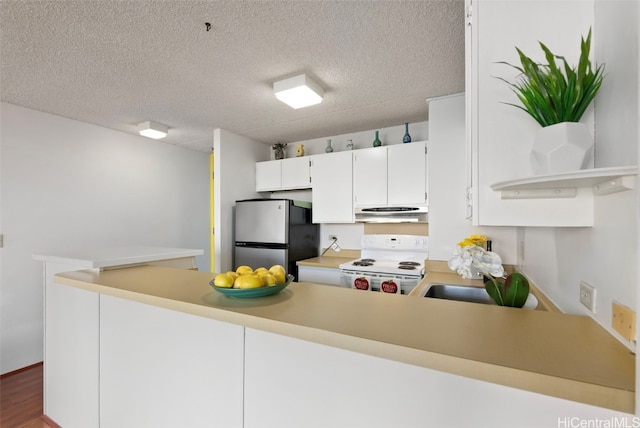 kitchen with dark wood-type flooring, white range with electric cooktop, white cabinets, kitchen peninsula, and stainless steel refrigerator