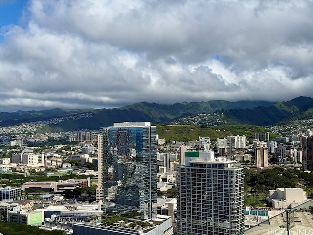 property's view of city with a mountain view