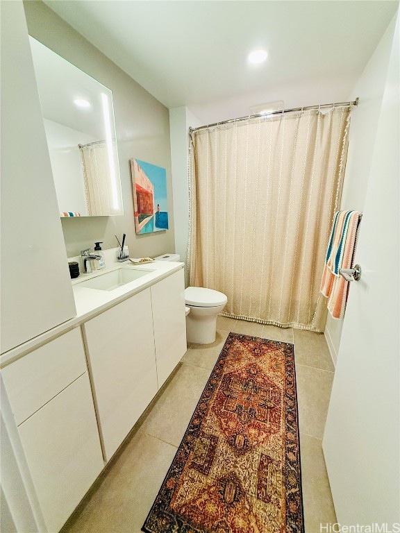 full bathroom with tile patterned floors, vanity, toilet, and shower / bath combo