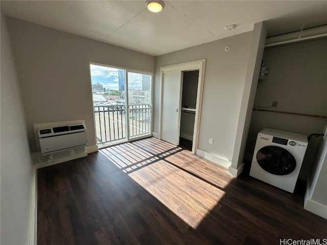 laundry room with heating unit, dark hardwood / wood-style floors, and washer / dryer