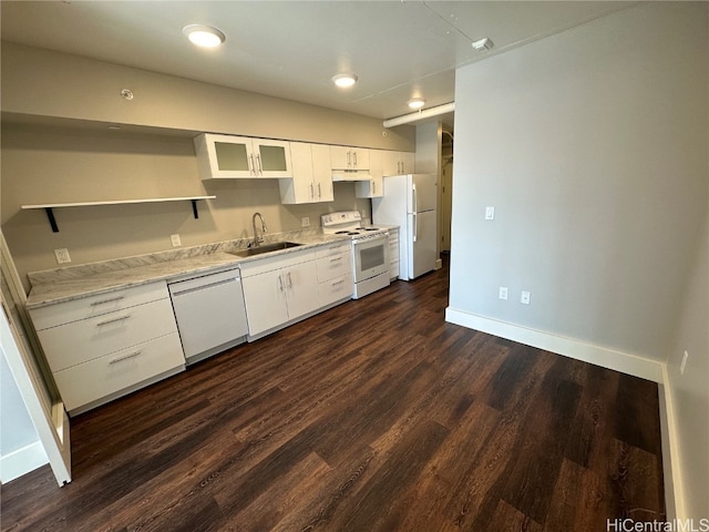 kitchen with white cabinetry, sink, dark wood-type flooring, and white appliances