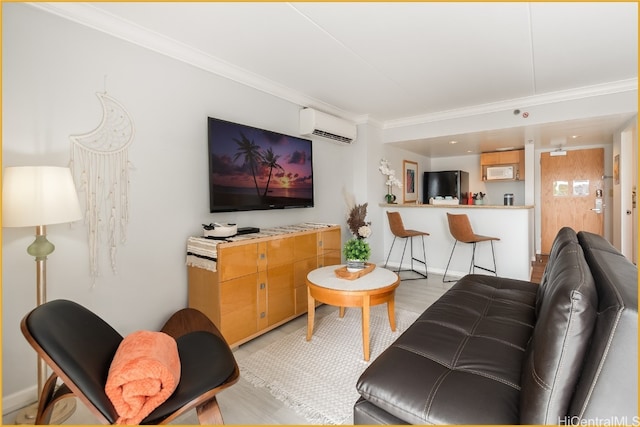 living room with an AC wall unit, crown molding, and light hardwood / wood-style flooring