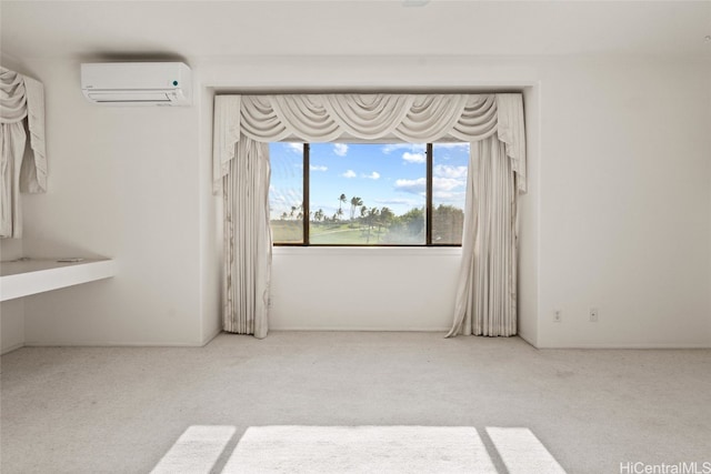 unfurnished room featuring a wall mounted air conditioner and carpet floors