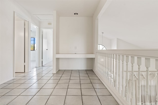 corridor with light tile patterned floors