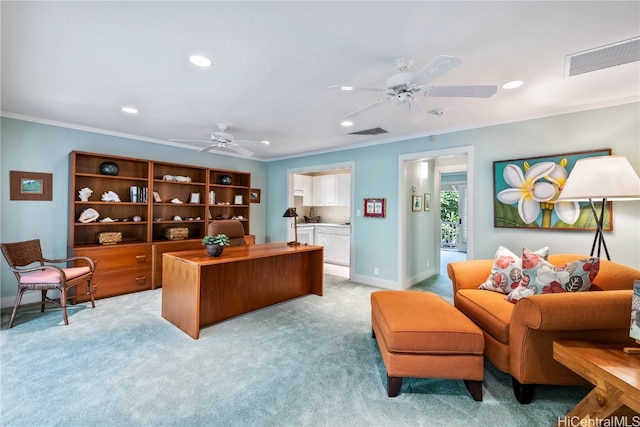 office space featuring ceiling fan, light colored carpet, and crown molding