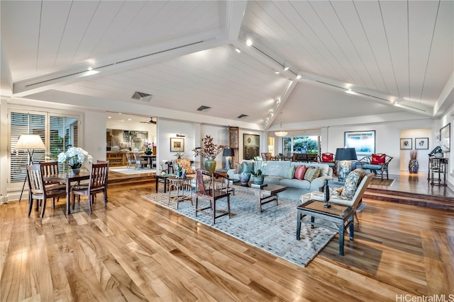 living room with wood ceiling, vaulted ceiling with beams, rail lighting, and light hardwood / wood-style floors