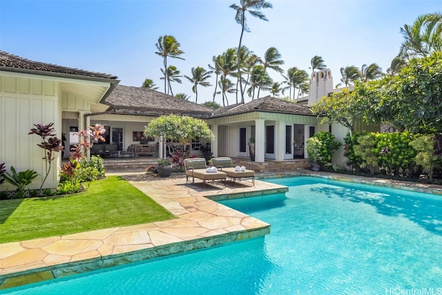 view of pool featuring a patio area and an outdoor structure