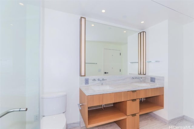 bathroom featuring toilet, vanity, and tasteful backsplash