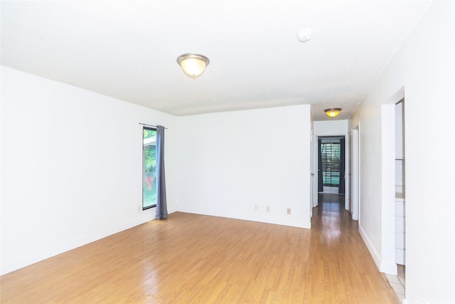 87-118 Helelua St Unit B101, Waianae, HI 96792 - spare room with baseboards and light wood finished floors