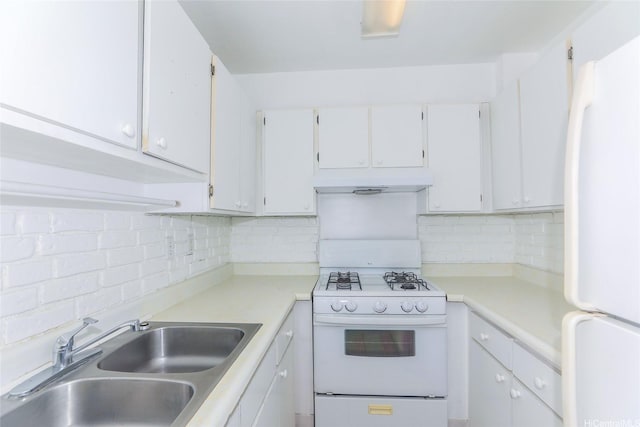 87-118 Helelua St Unit B101, Waianae, HI 96792 - kitchen with a sink, white cabinets, white appliances, light countertops, and tasteful backsplash