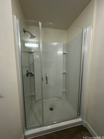 bathroom featuring an enclosed shower