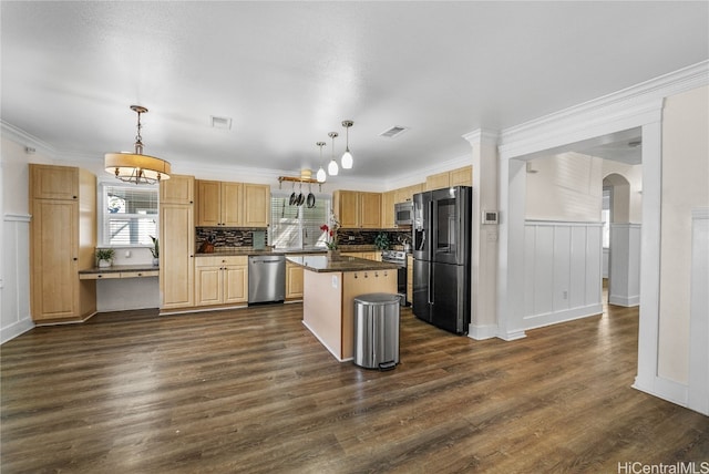 kitchen featuring stainless steel appliances, hanging light fixtures, a center island, and dark wood-type flooring