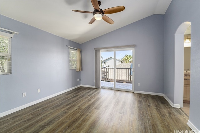 unfurnished room with dark hardwood / wood-style flooring, lofted ceiling, and ceiling fan