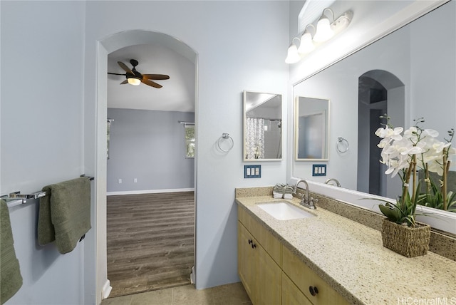 bathroom with vanity, wood-type flooring, and ceiling fan