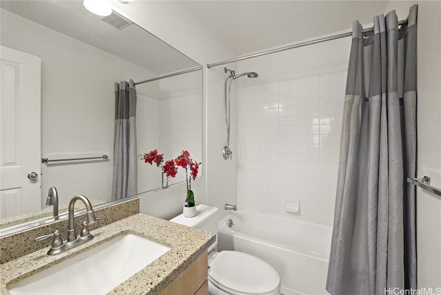 full bathroom with vanity, toilet, and shower / bath combo