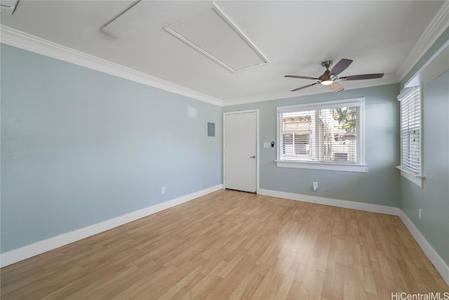 spare room with ornamental molding, ceiling fan, and light hardwood / wood-style flooring