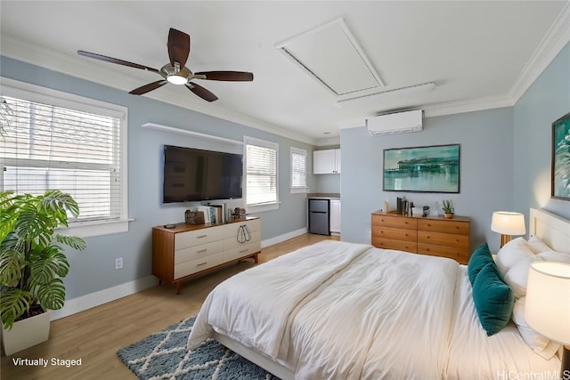 bedroom featuring ceiling fan, ornamental molding, a wall unit AC, and light wood-type flooring