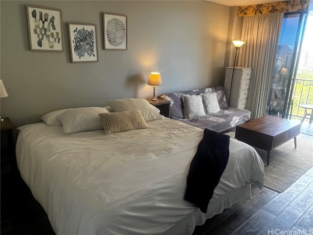 bedroom with access to outside and wood-type flooring