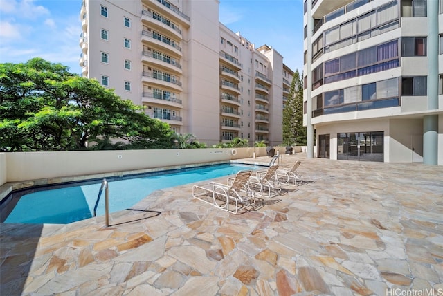 view of swimming pool featuring a patio