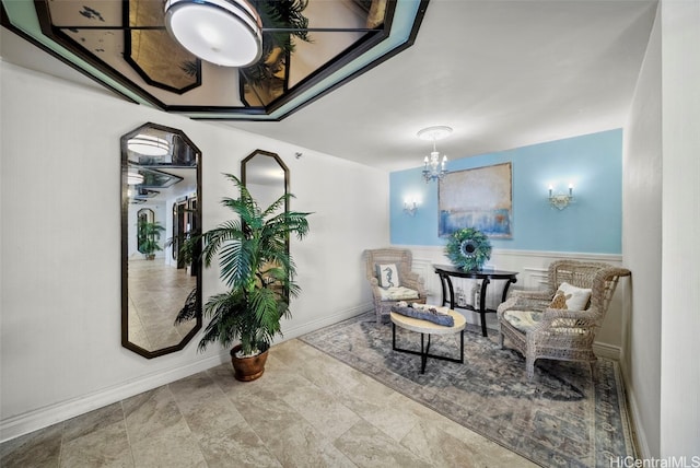 living area with a chandelier