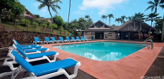 view of swimming pool featuring a patio area