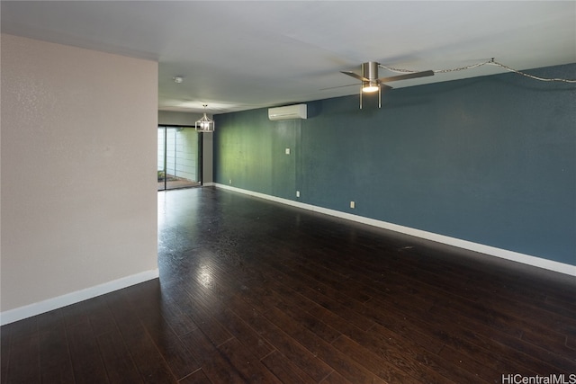 unfurnished room featuring an AC wall unit, ceiling fan, and hardwood / wood-style flooring