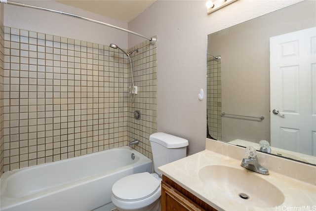 full bathroom featuring vanity, toilet, and tiled shower / bath combo