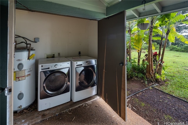 laundry room with washing machine and dryer and gas water heater