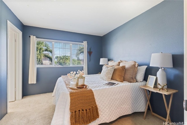 bedroom with light colored carpet