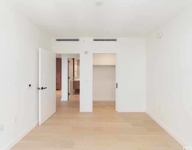 spare room featuring light hardwood / wood-style floors