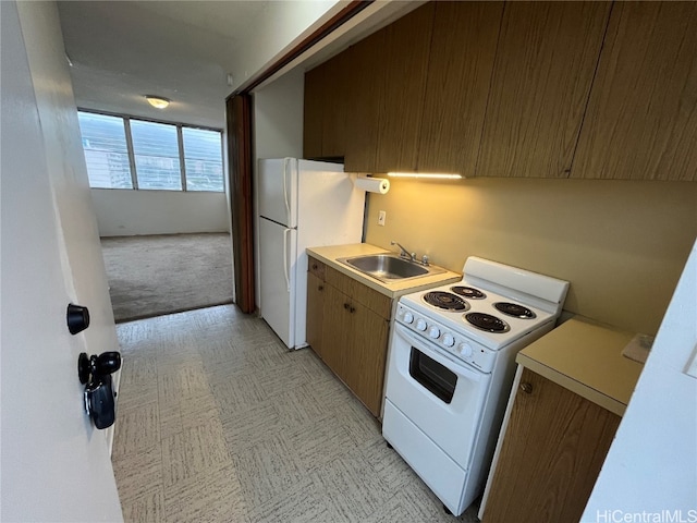 kitchen with white appliances and sink