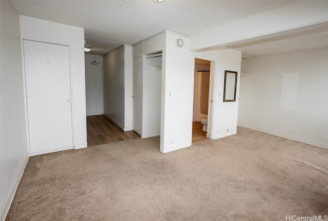 unfurnished bedroom featuring carpet flooring