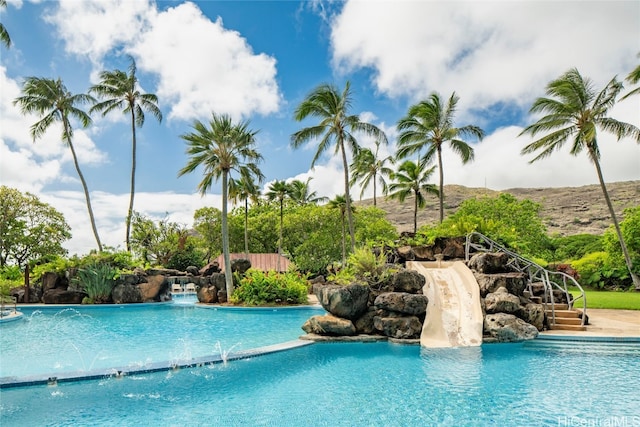 view of pool with pool water feature