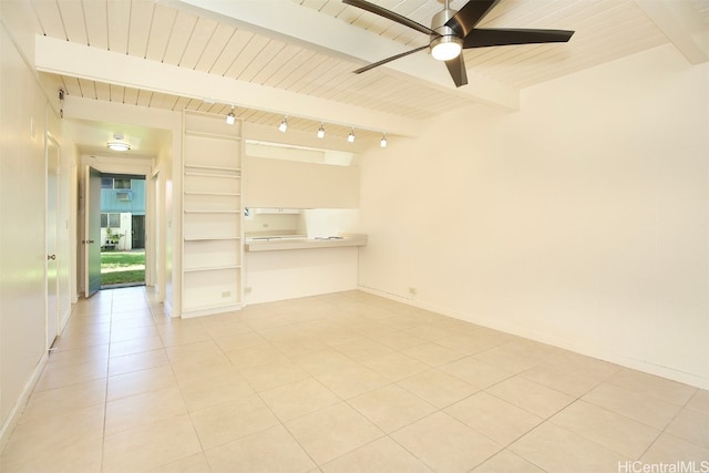 unfurnished room with beamed ceiling, light tile patterned floors, ceiling fan, and wood ceiling