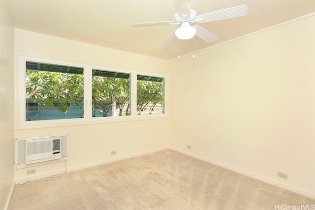 empty room featuring light carpet, ceiling fan, and a wall mounted air conditioner