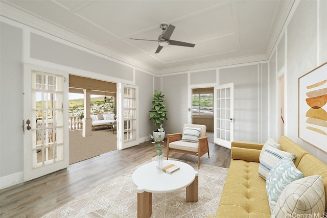 living area with french doors, plenty of natural light, and wood-type flooring