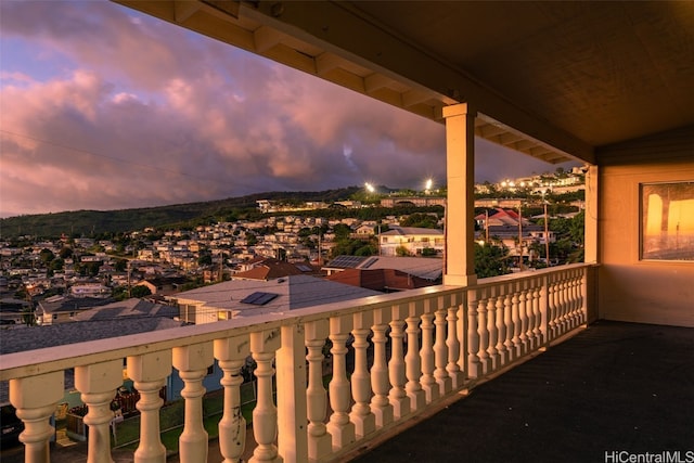 view of balcony at dusk