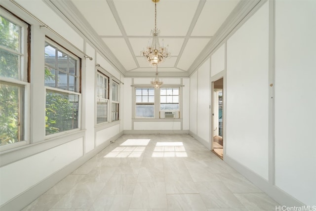 unfurnished sunroom featuring cooling unit, a healthy amount of sunlight, and a chandelier