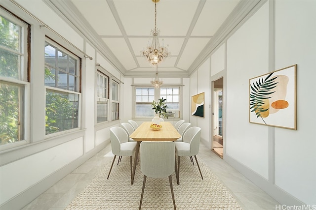 sunroom / solarium featuring an inviting chandelier