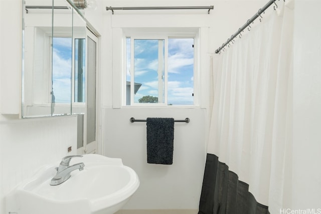 bathroom with sink and a wealth of natural light